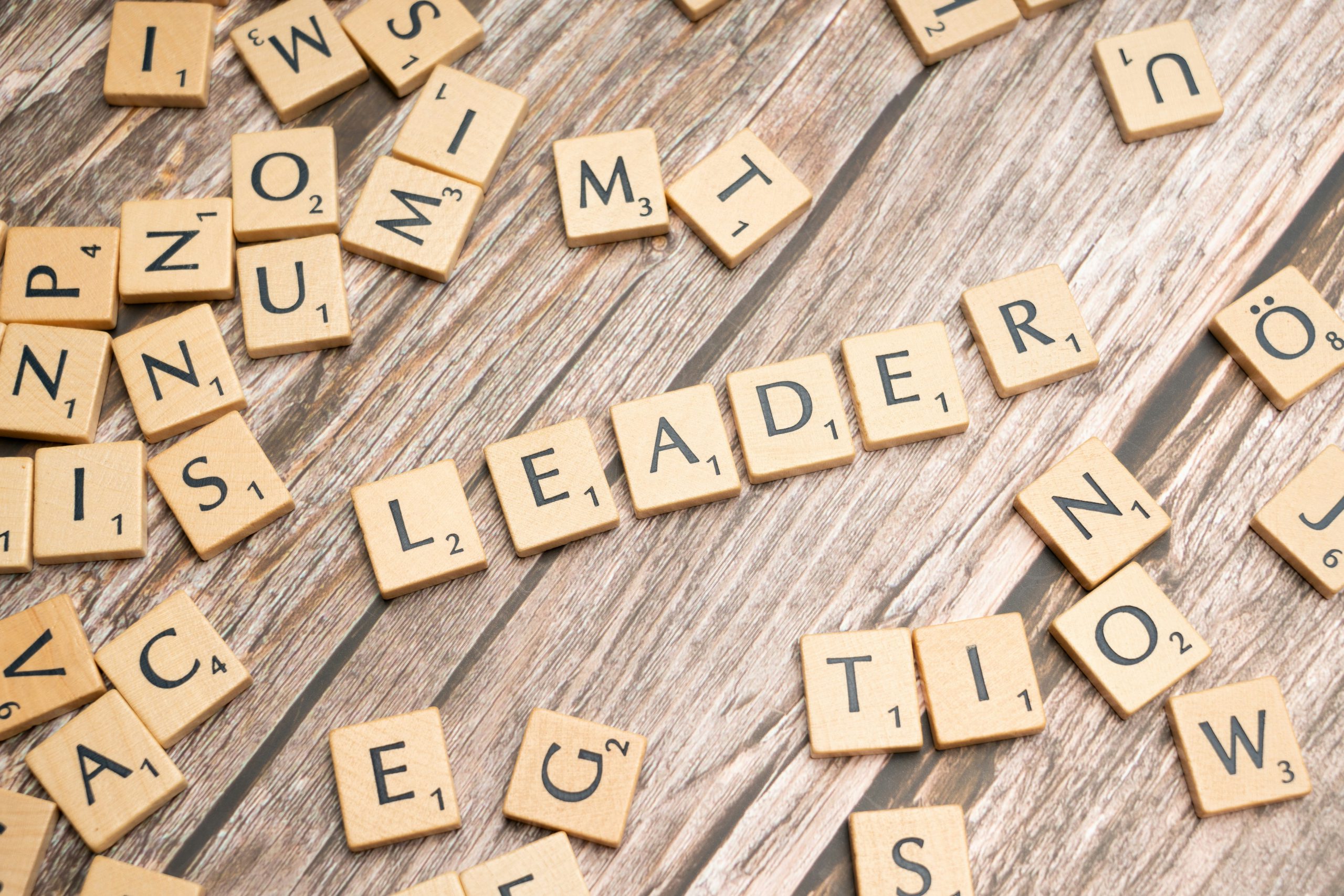 Scrabble tiles spelling out the word leader
